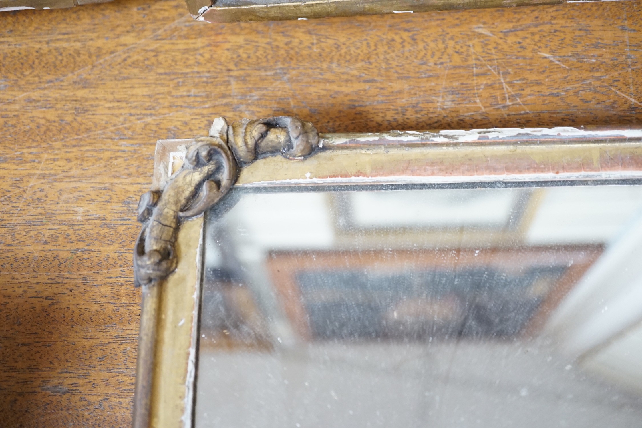 A gilt wooden mirror, 49cms wide, 40cm high